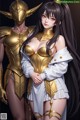 A woman in a white dress standing next to a man in a gold armor.