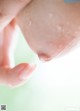 A close up of a person's hand holding a piece of food.